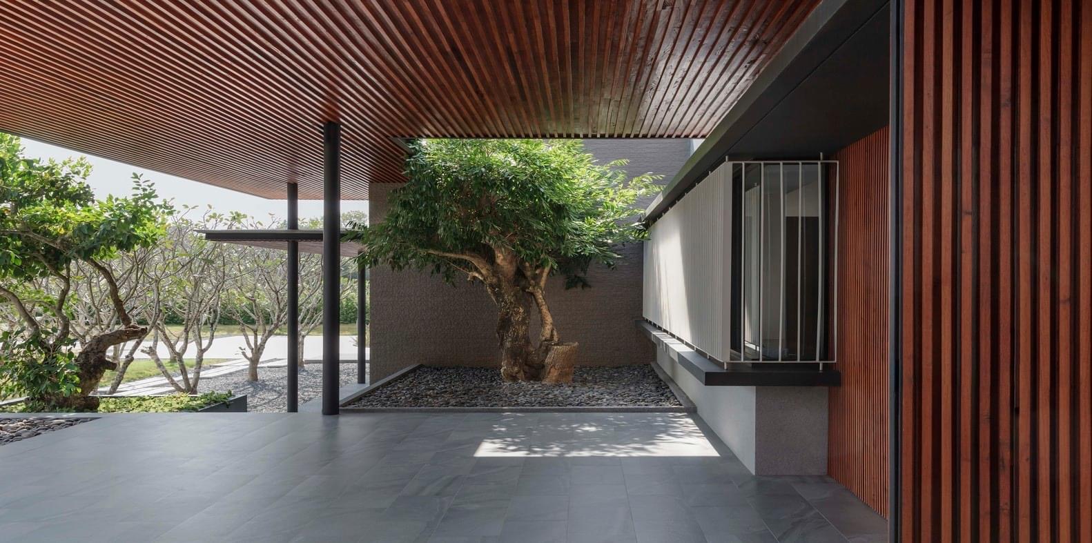 Premium front elevation with louvers slim glass windows and HPL facade India