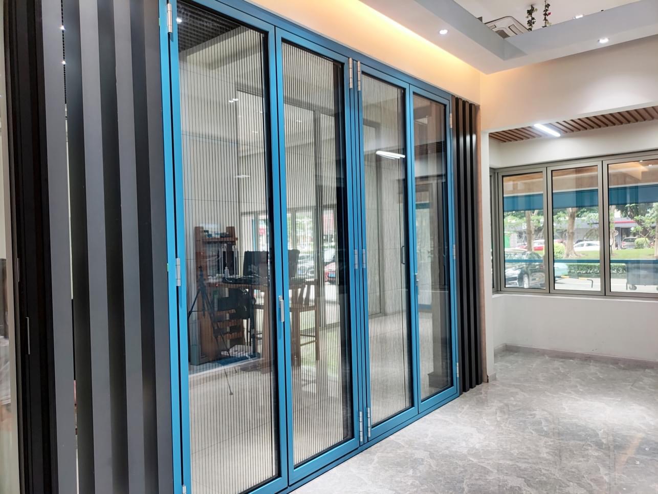 Premium aluminium bi-fold glass door with slim profile and soft roller hardware